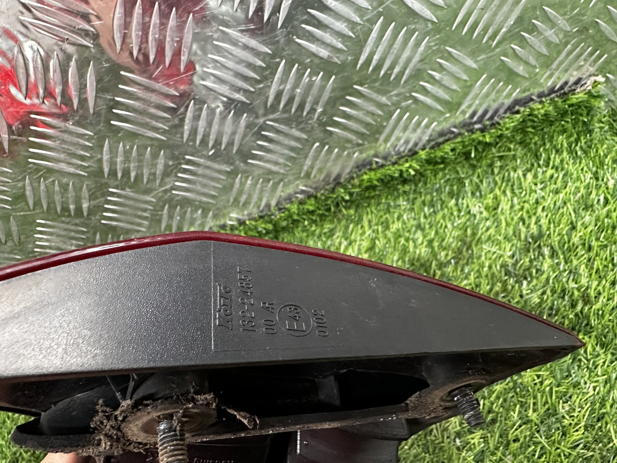 2005-2018 Nissan Wingroad Y1452 - Left Tailgate Garnish PN: KOITO-132-24867
