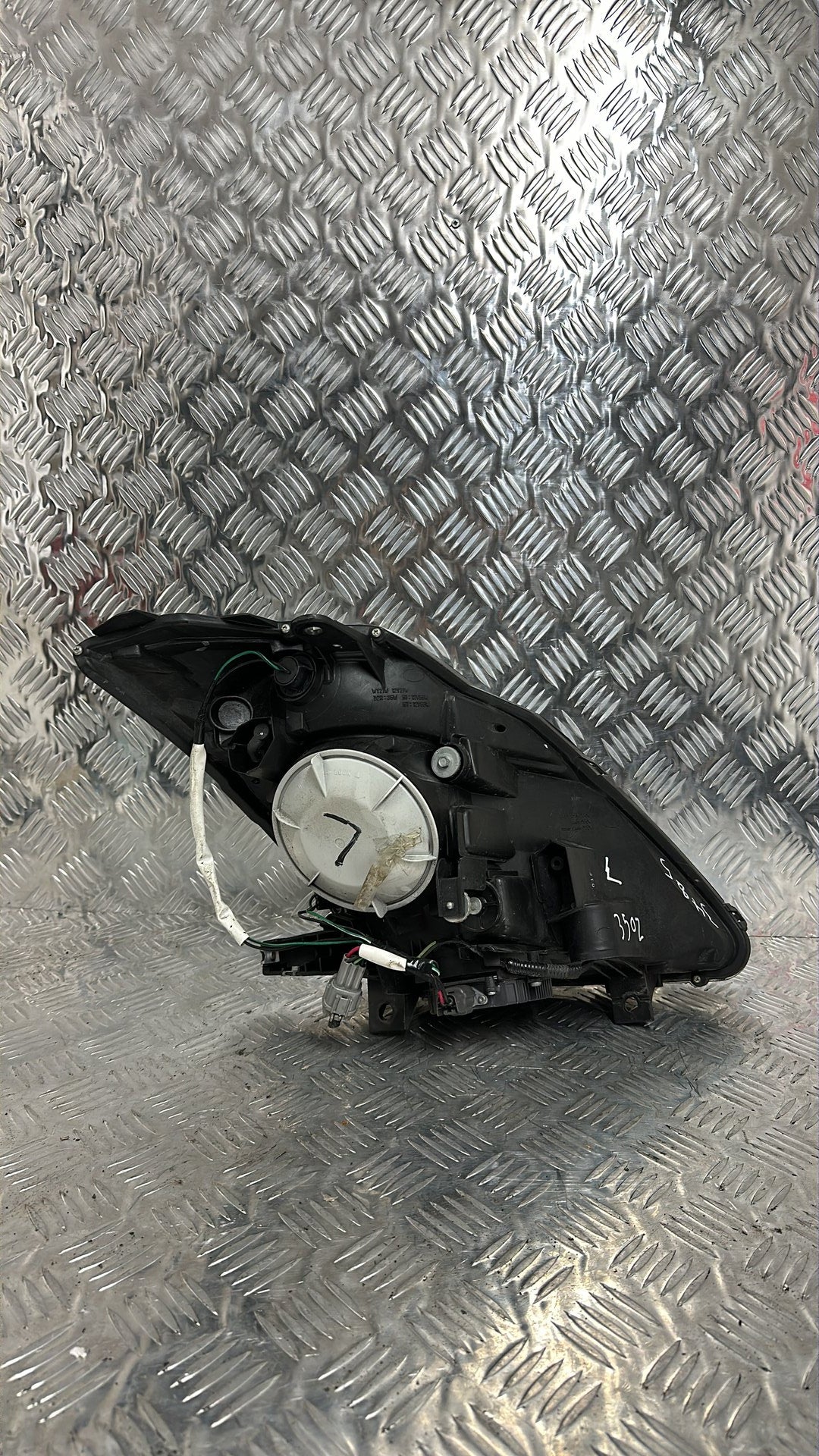 2002-2007 Nissan 350Z Left Headlight Koito 100-63705