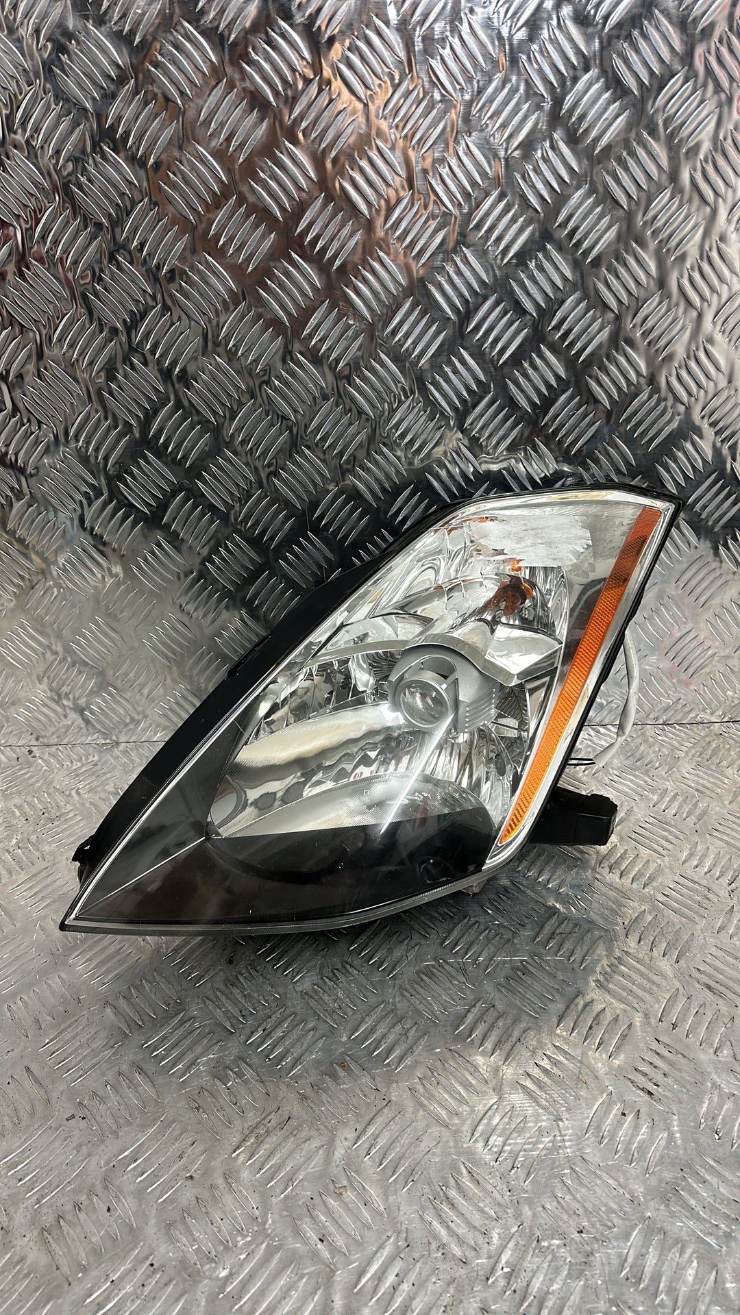2002-2007 Nissan 350Z Left Headlight Koito 100-63705
