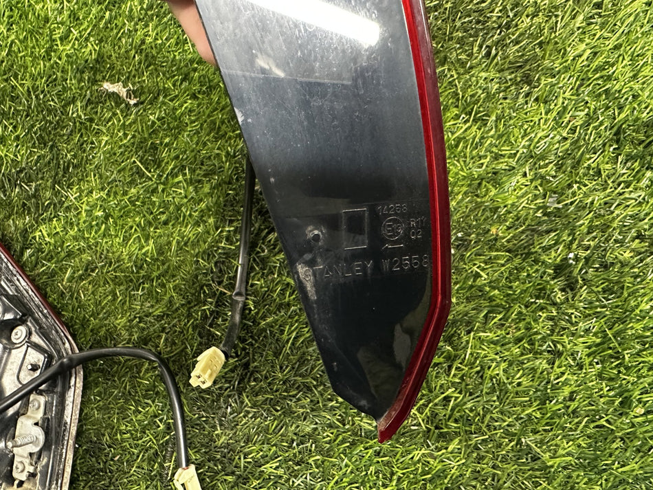 2012-2021 Mitsubishi Outlander PHEV - Left Tailgate Garnish PN: STANLEY W2558